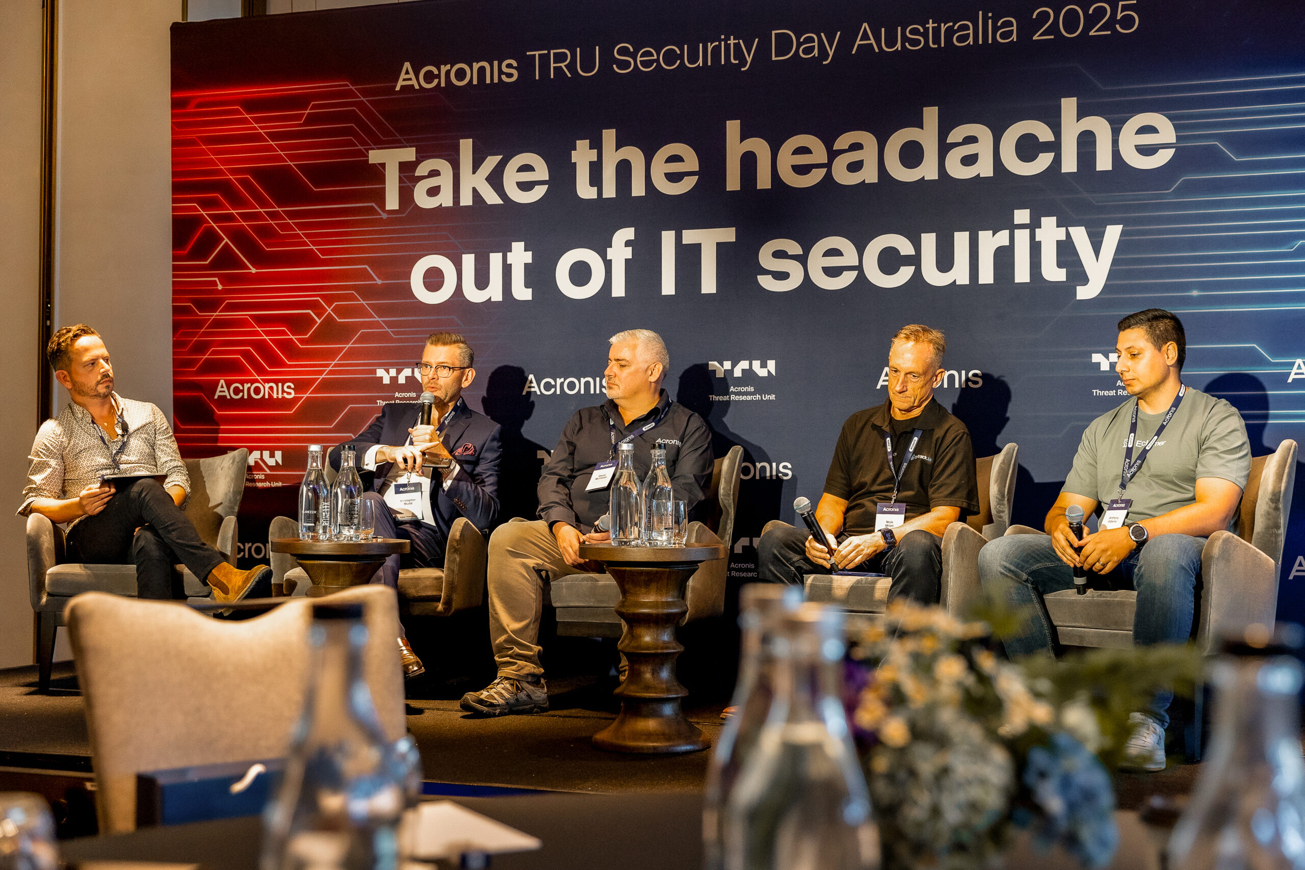 Dan Boufarhat, Director of IT First Responder moderating a panel at Acronis TRU Security Day 2025 Australia
